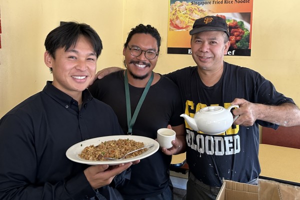 SFE staff holds up reusable foodware with San francisco restaurant owner