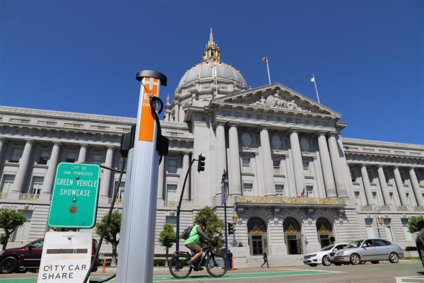 An electric car charging station seen in front of the San Francisco City Hall building