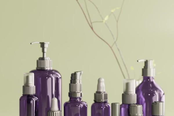 A group of purple bottles sitting on top of a table photo – Free Render Image on Unsplash