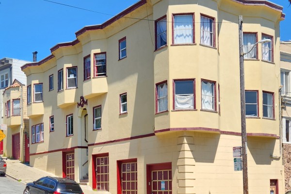 multi family residence with sidewalk in front