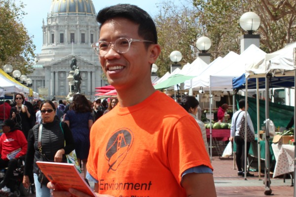 Photo featuring a household hazardous waste expert, providing educational resources to inform San Francisco residents at a local farmers market..
