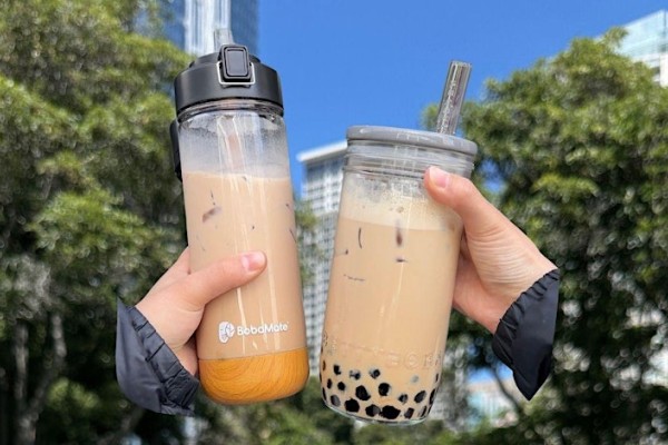 Two boba drinks in  reusable mugs
