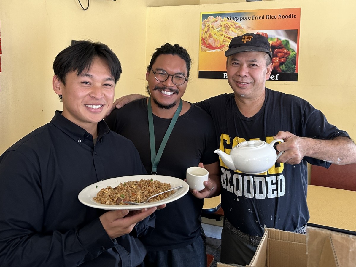 SFE staff holds up reusable foodware with San francisco restaurant owner