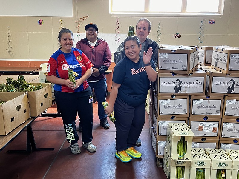 SF Market staff with recovered food in the warehouse