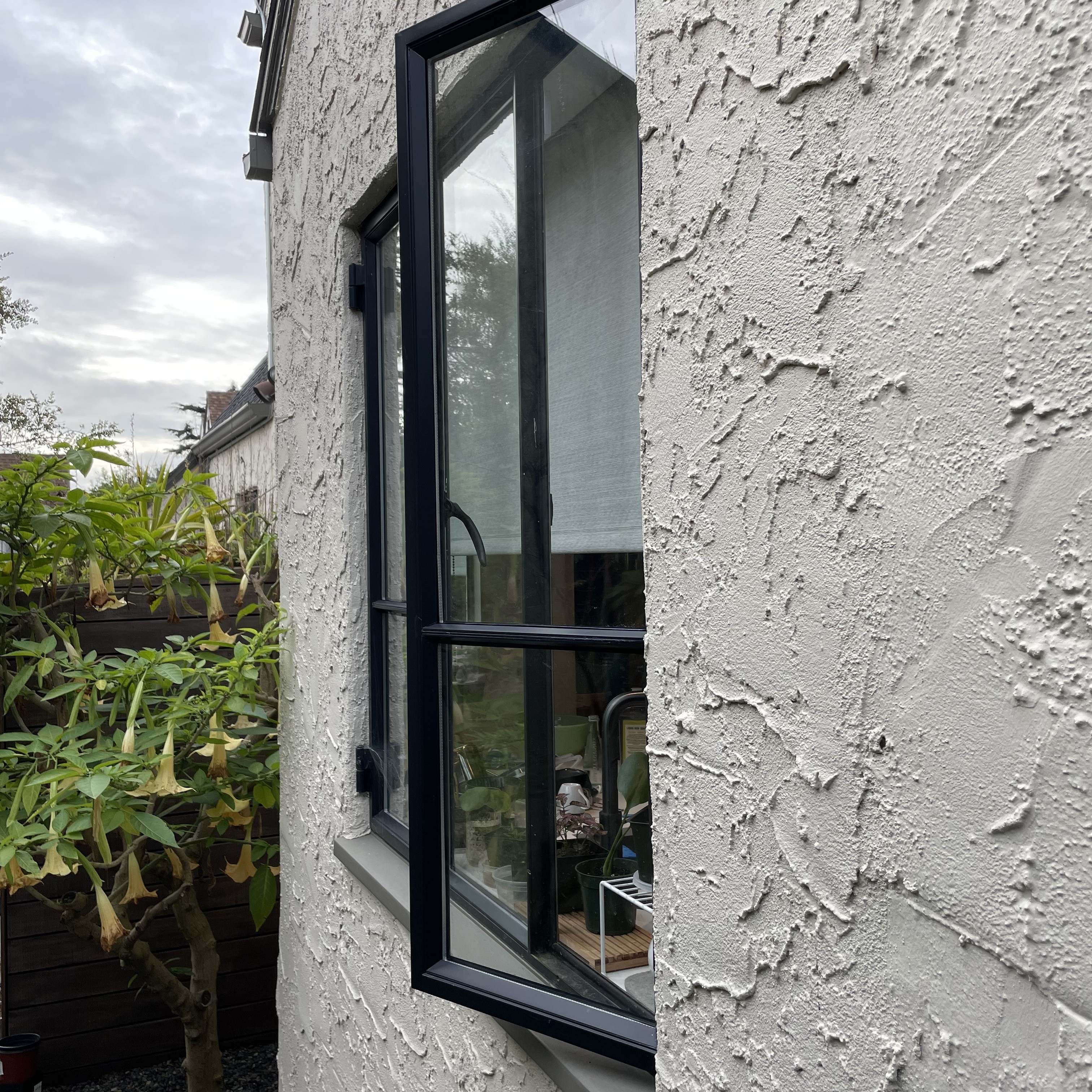 A vertical window is slightly ajar