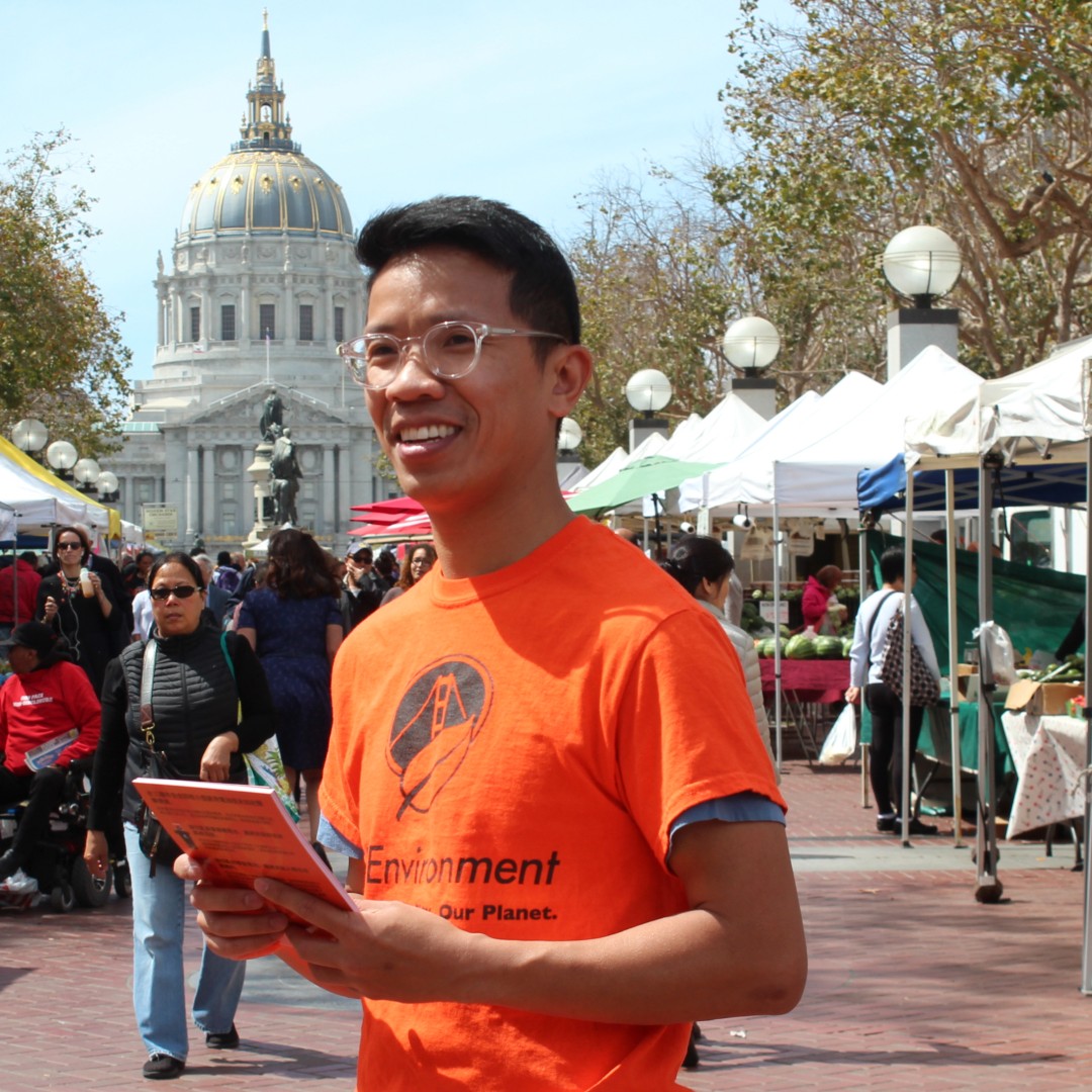Photo featuring a household hazardous waste expert, providing educational resources to inform San Francisco residents at a local farmers market..