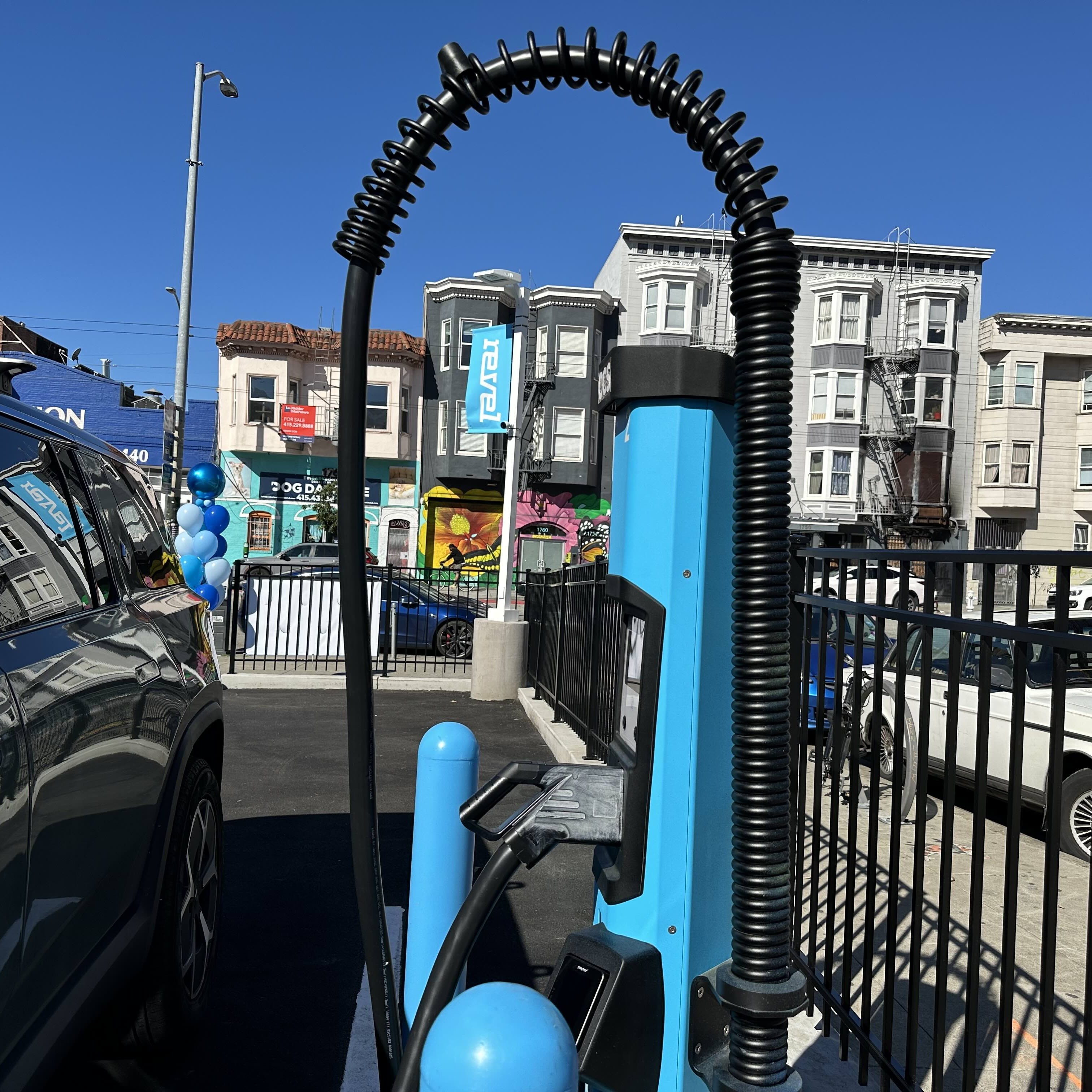 A blue charging port for electric vehicles built by the EV charging company Revel