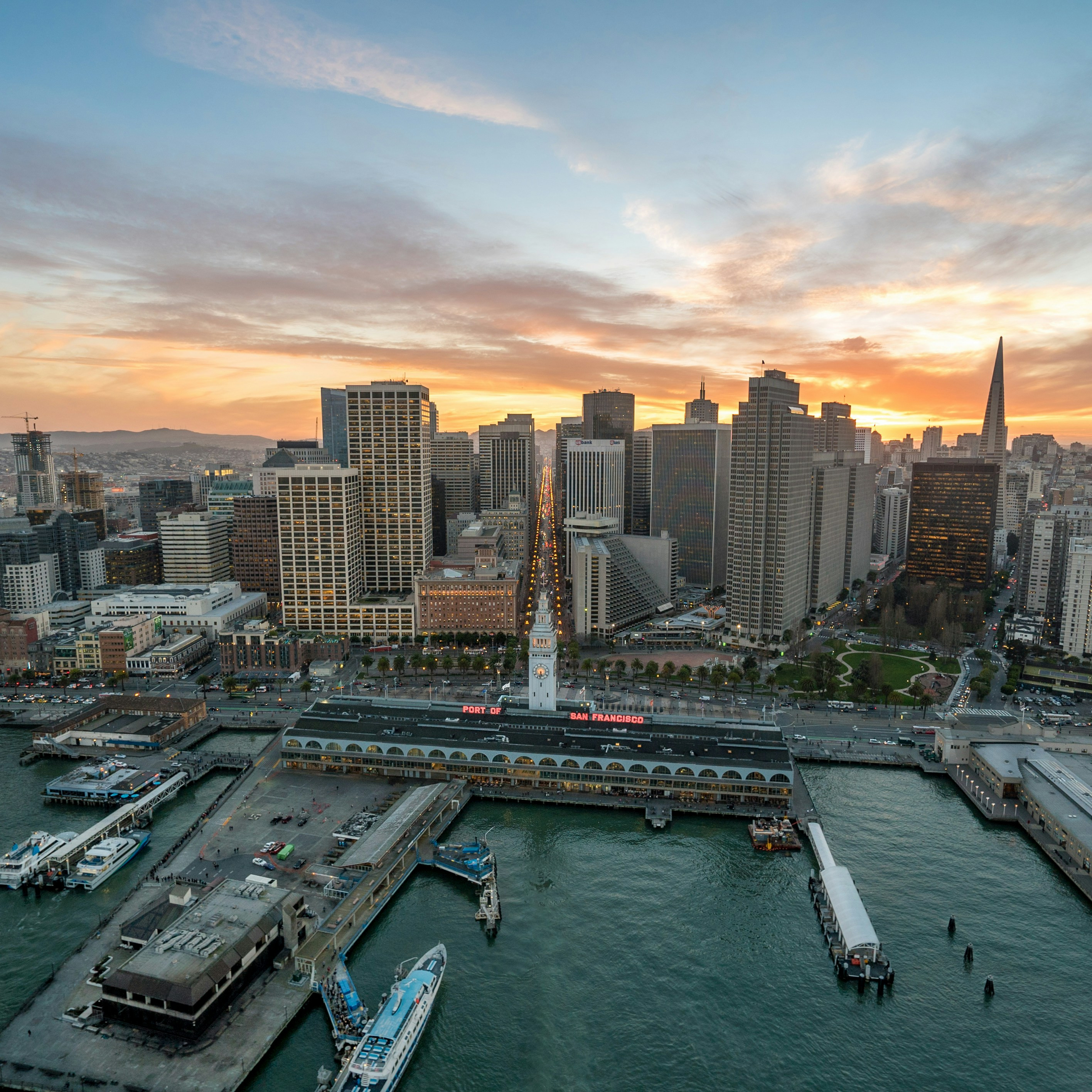 San Francisco Embarcadero station with financial district commercial buildings and the port
