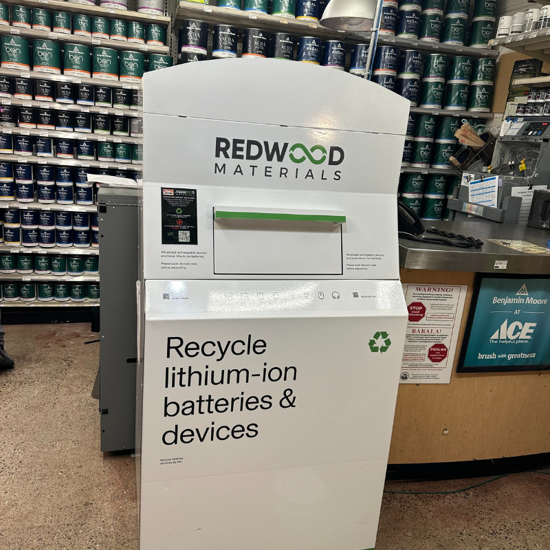 A large kiosk for recycling inside of a Cole Hardware store