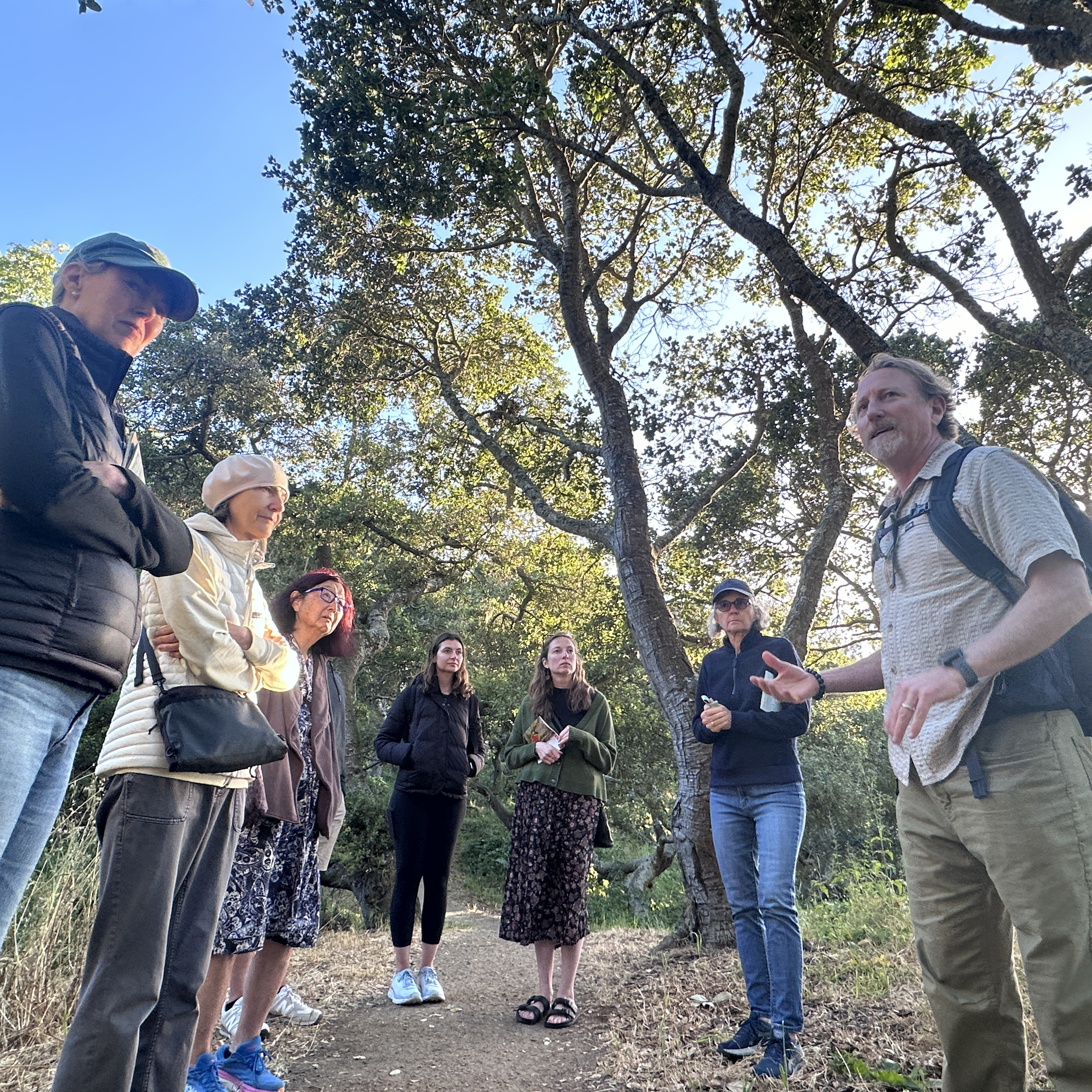 SFE staff hosts a small group of volunteers in a natural park
